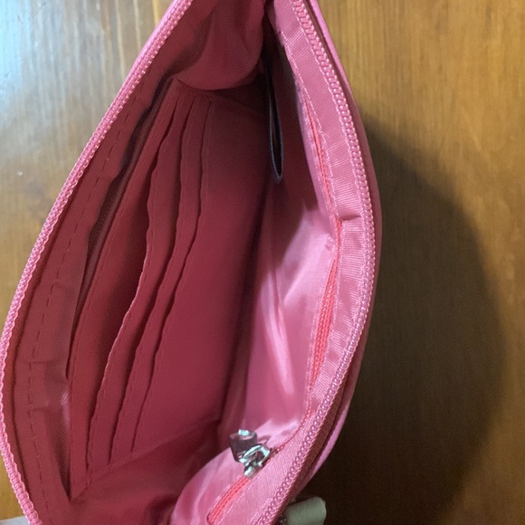 Small pink zipper wallet with white stripe. - Picture 3 of 3